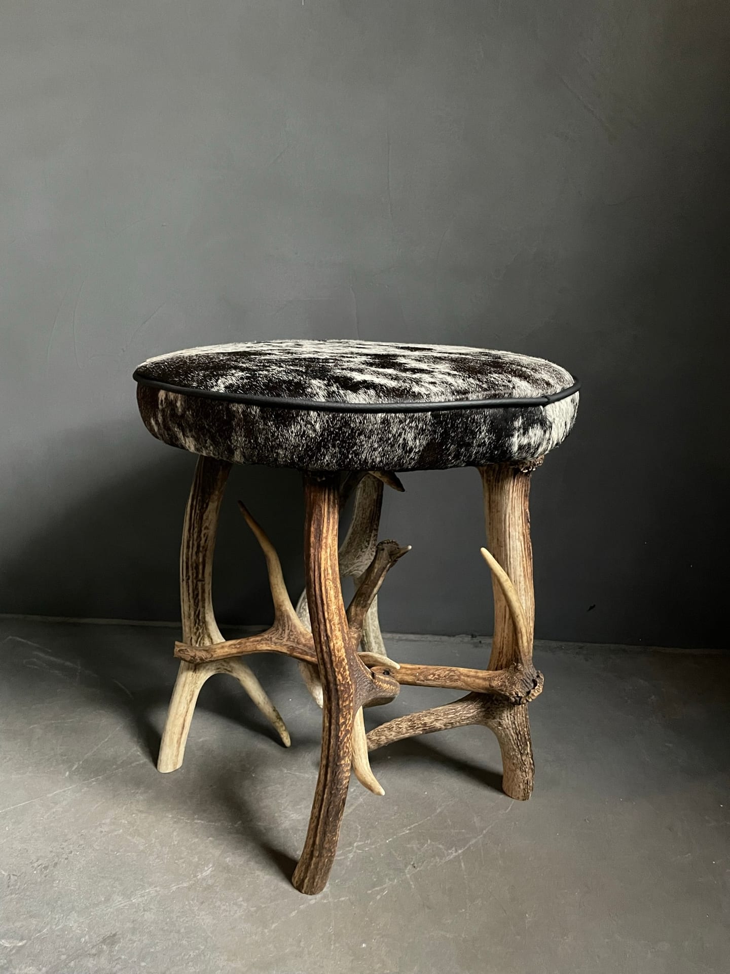 Antler stool covered with beautiful cowhide