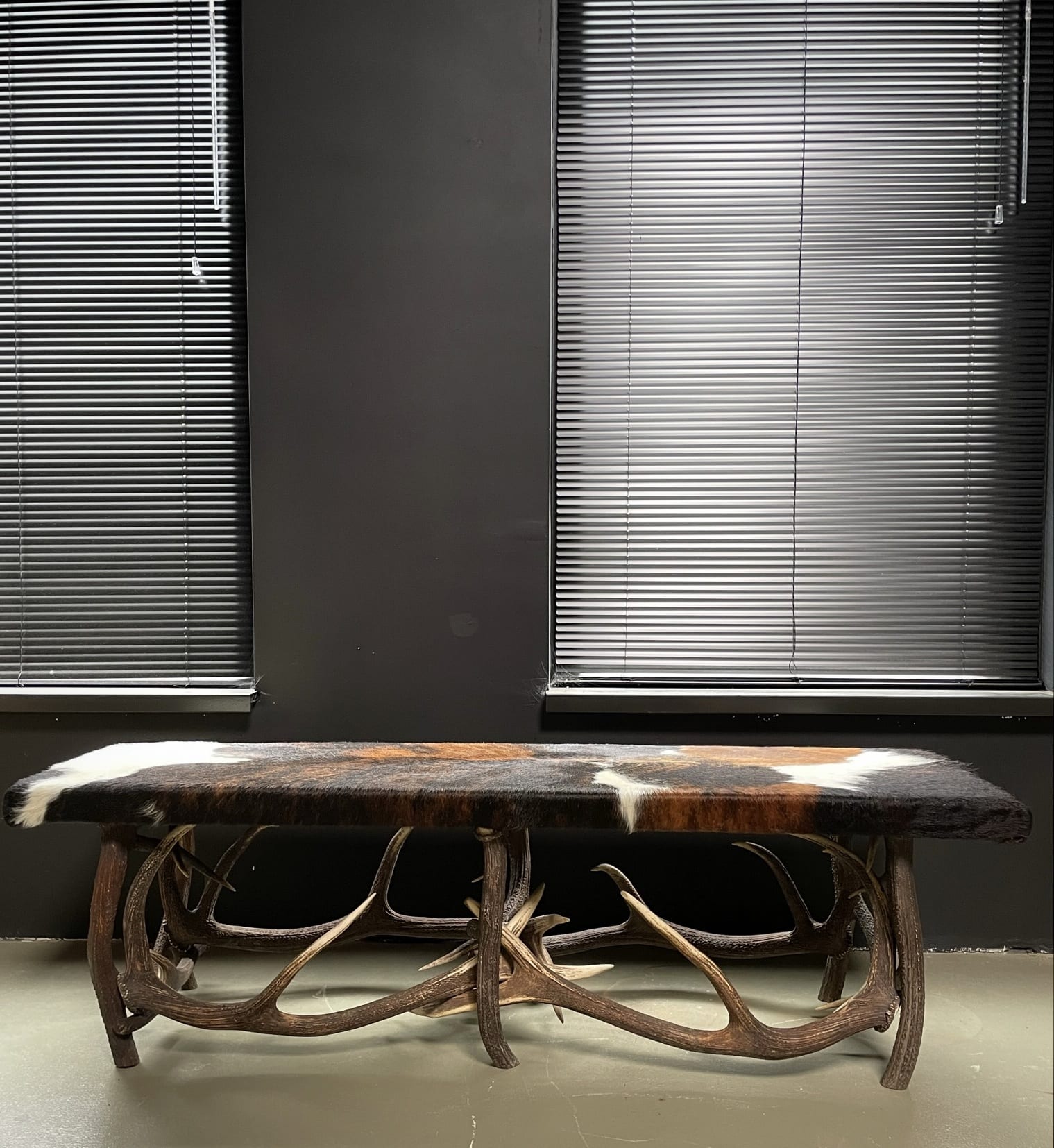 Antler bench covered with cowhide