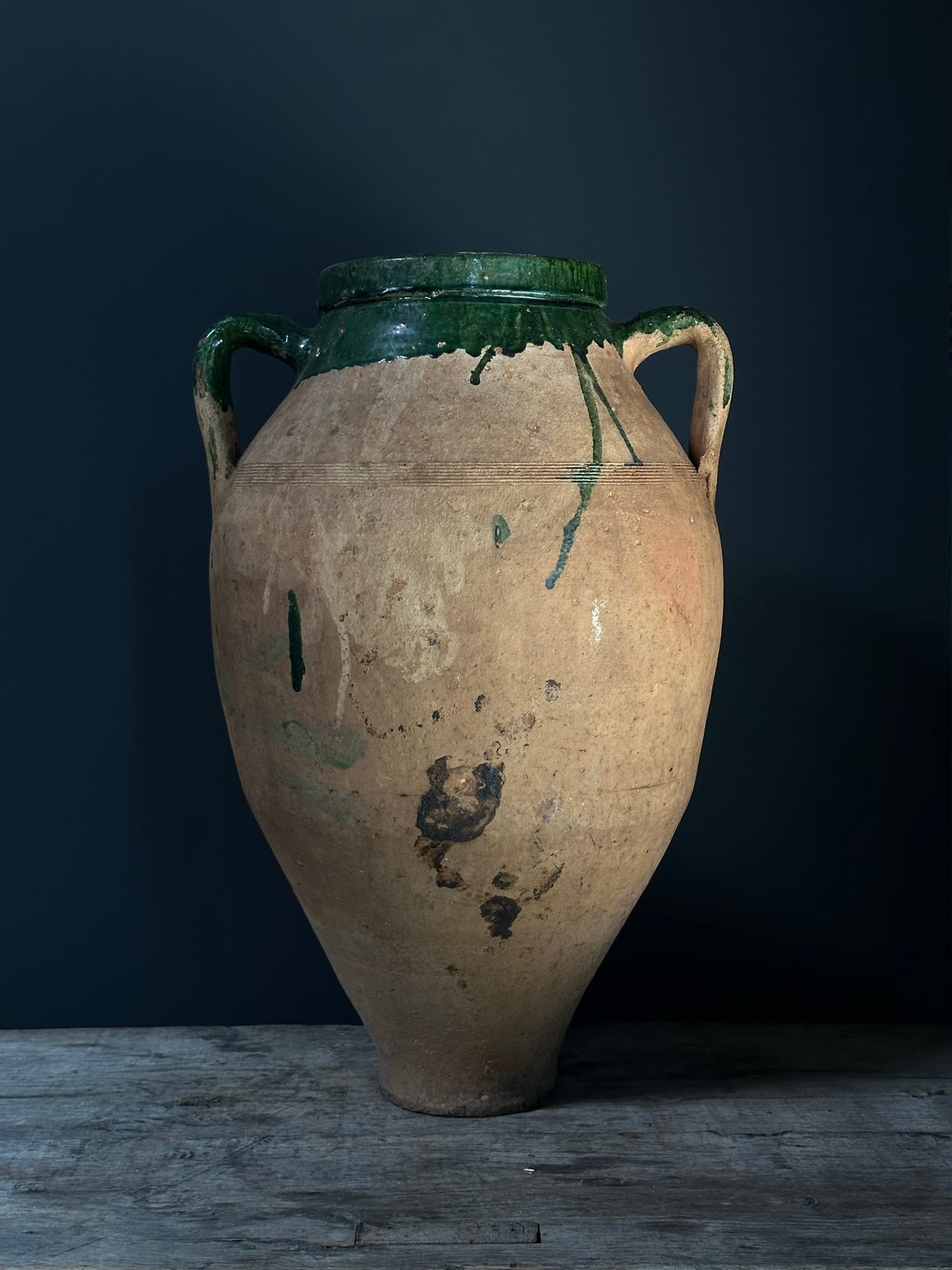 Antique olive pitcher