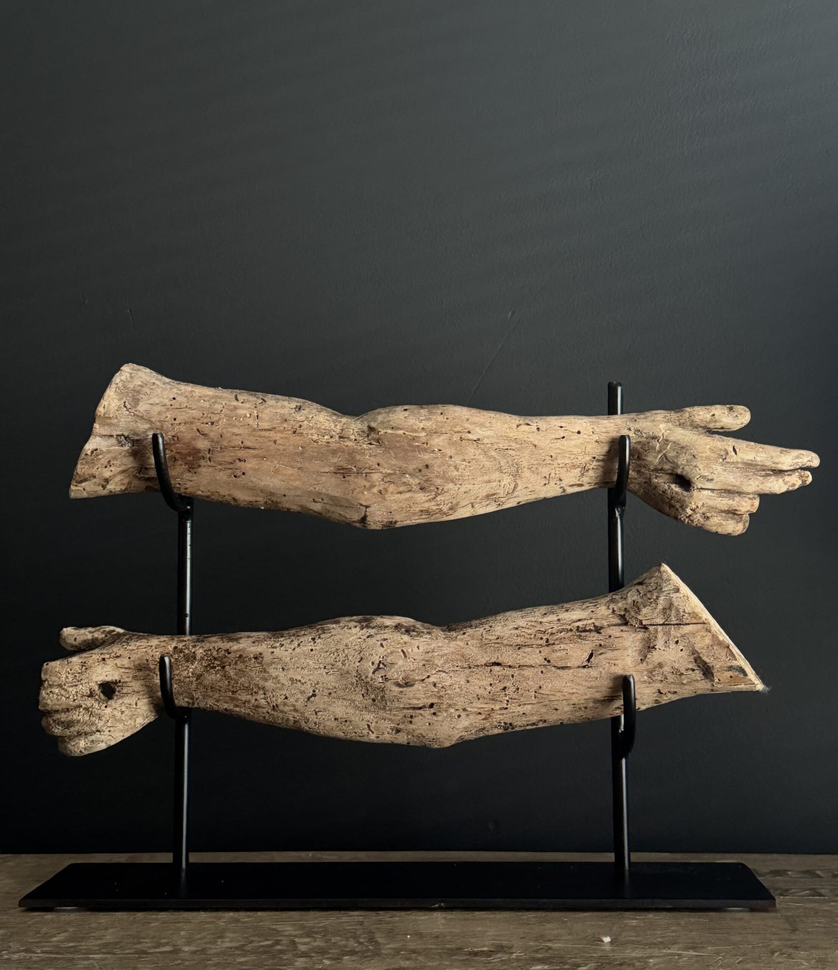 Decorative 17th-century wooden arms.